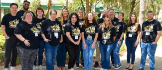 A group of PHSC staff members posting for a photo at Fall Kickoff.